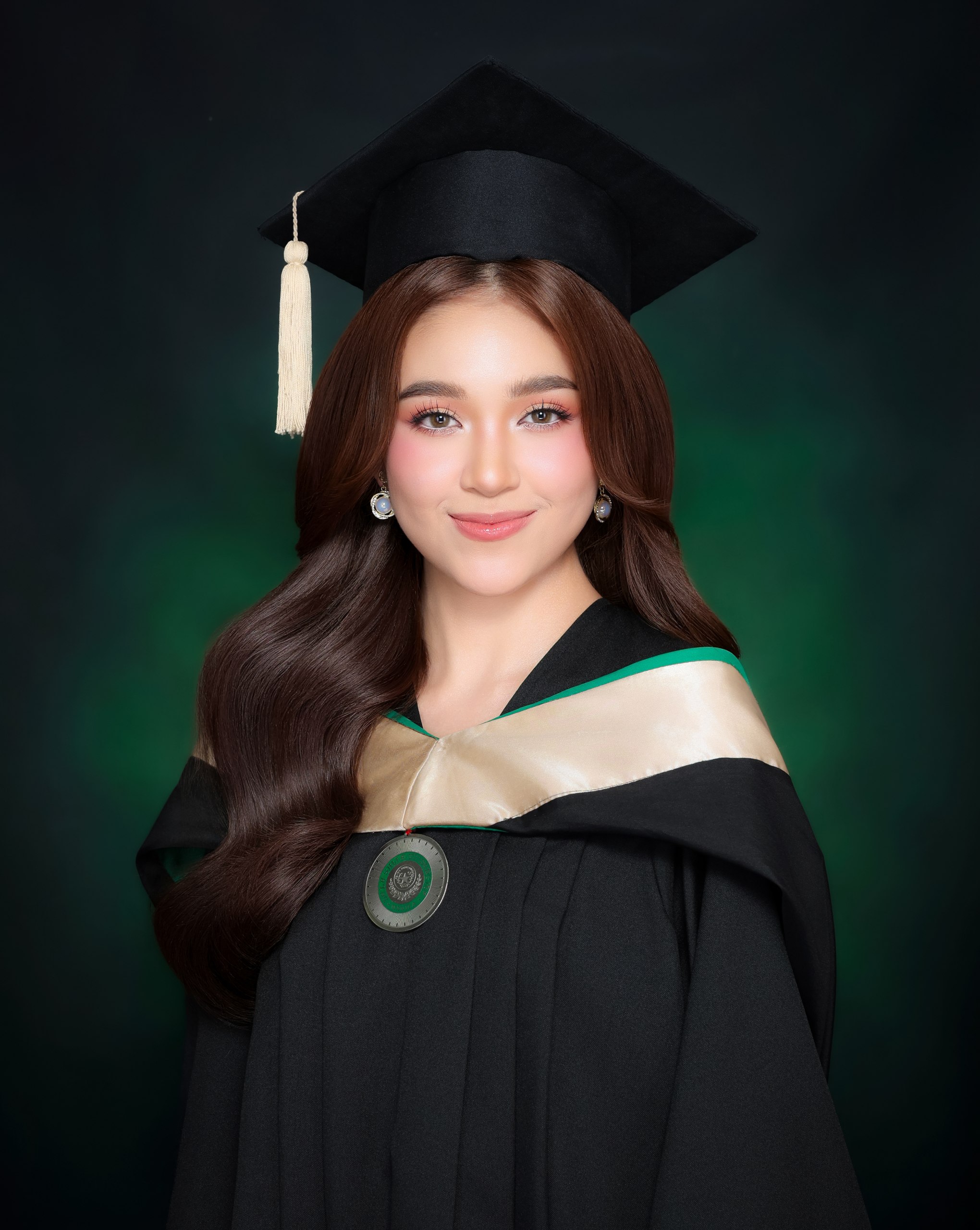 Graduation portrait with toga and cap