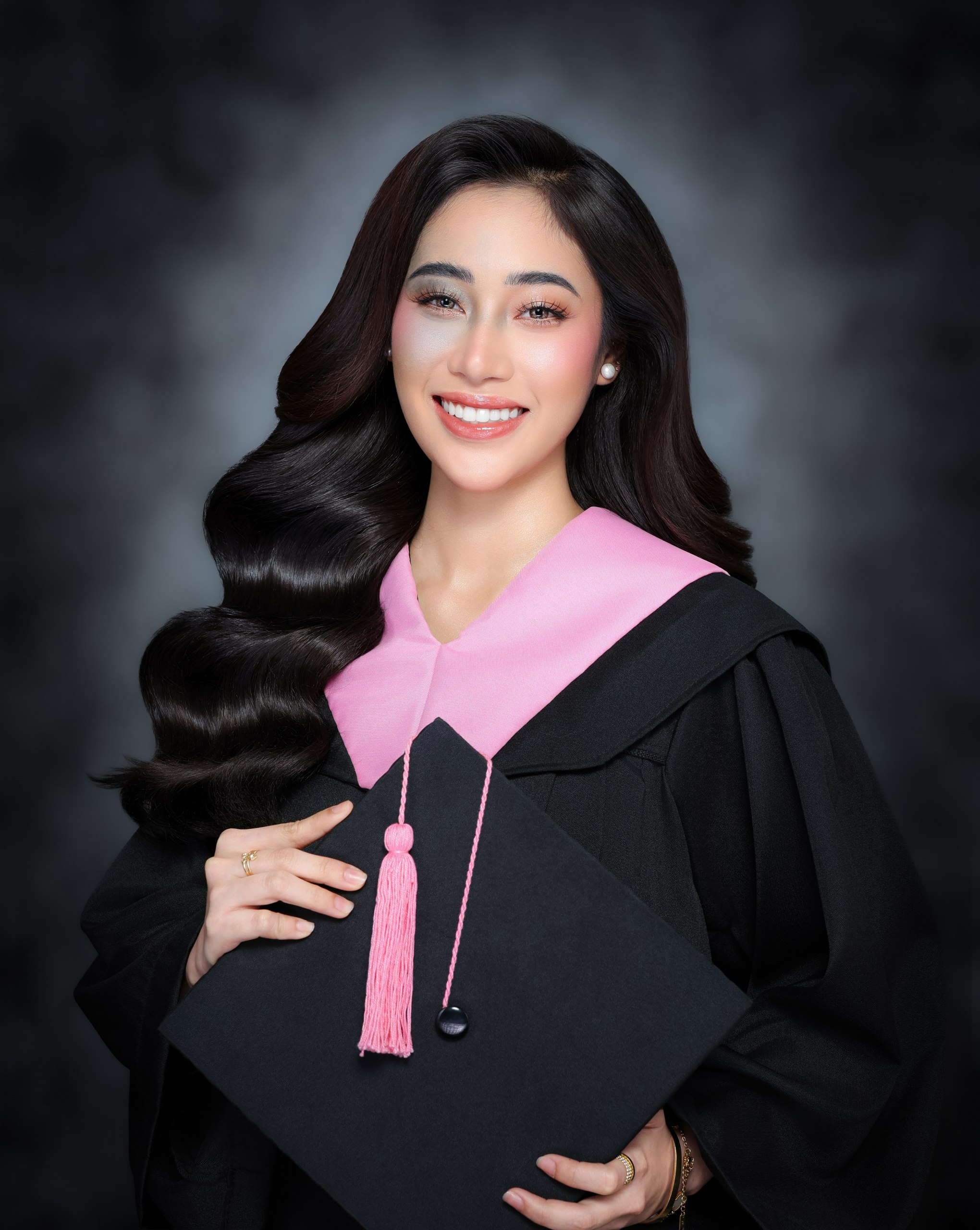 Graduation portrait with toga and cap